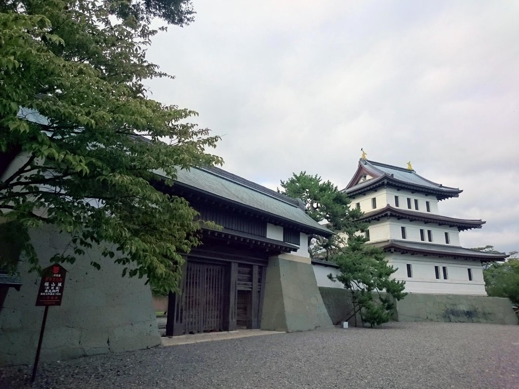 Traditional Japanese castle with stone walls and wooden architecture