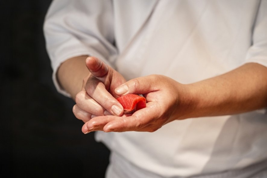 Sushi being eaten by hand at traditional restaurant