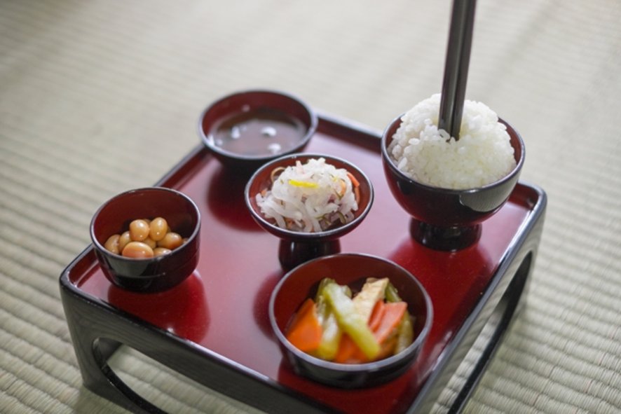 Chopsticks standing upright in rice bowl taboo