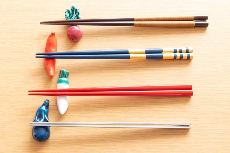 Display of various wood types for chopstick making workshop in Ginza
