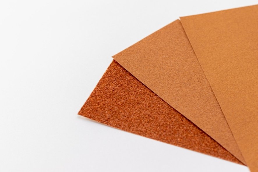 Sanding chopstick tips with sandpaper at Ginza workshop