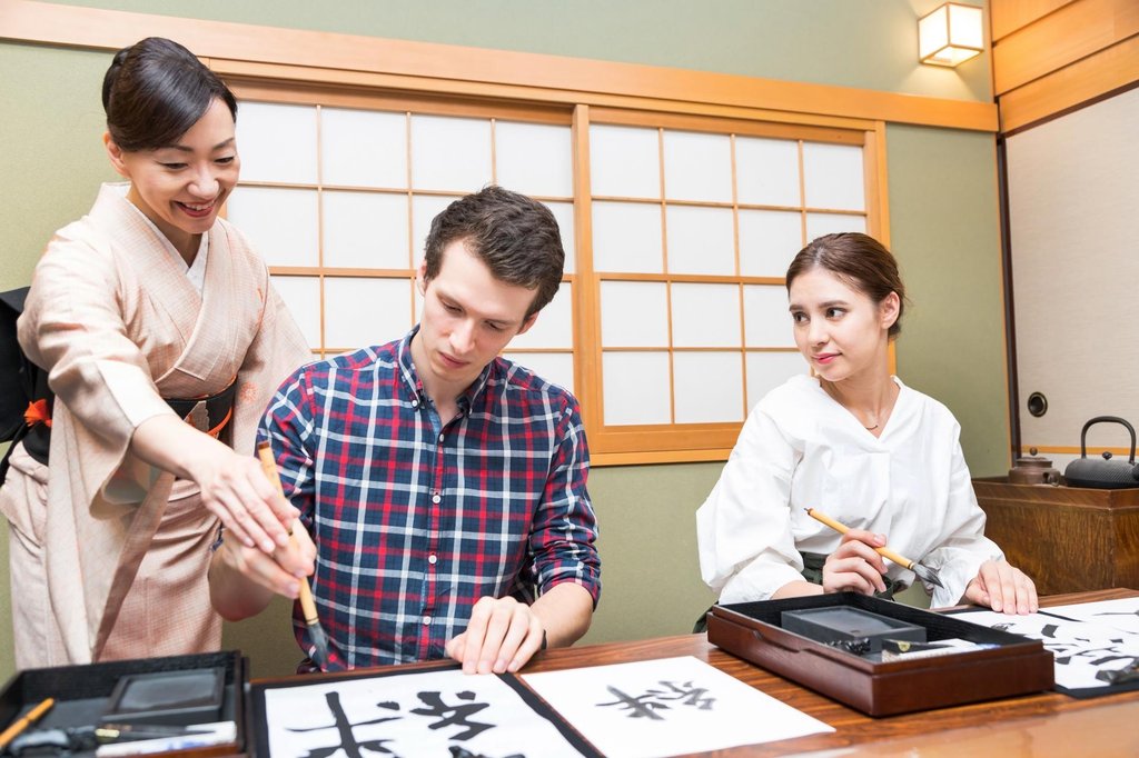 Japanese calligraphy workshop with students and instructor