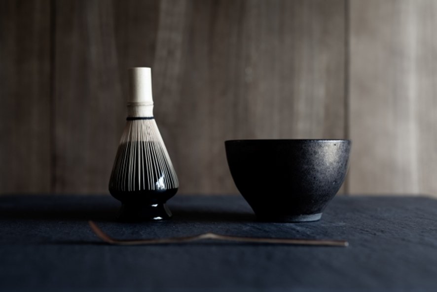 Guest observing proper tea ceremony etiquette