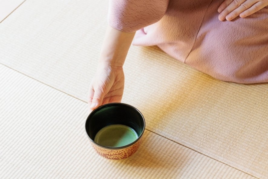 Guests bowing respectfully during tea ceremony