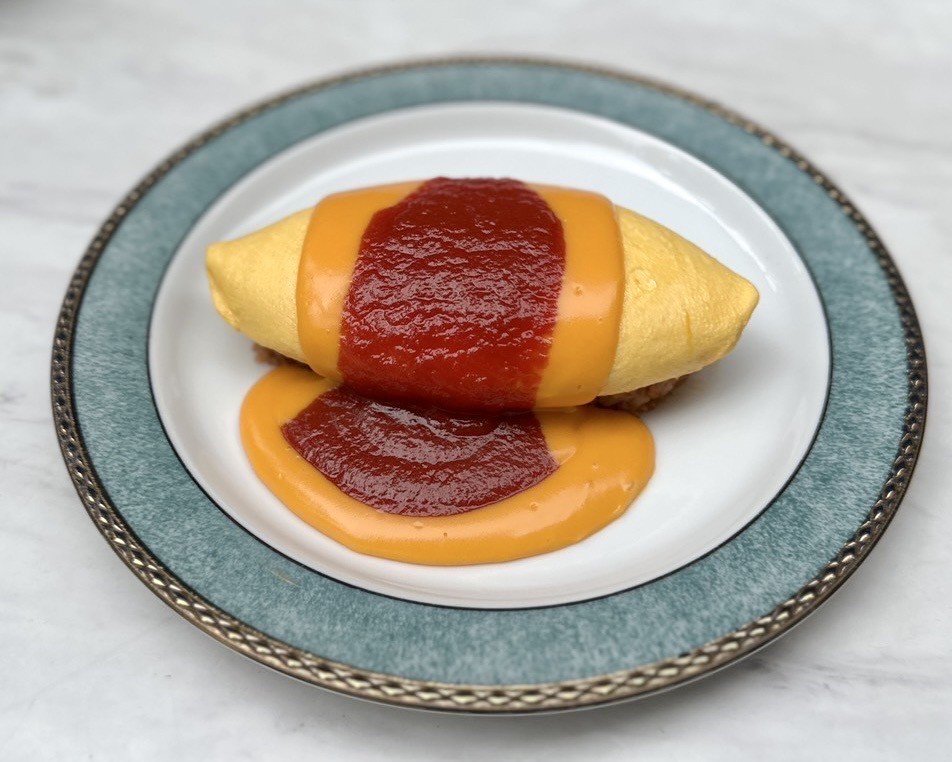 Pakkaan omurice performance at Sweet Check Omotesando