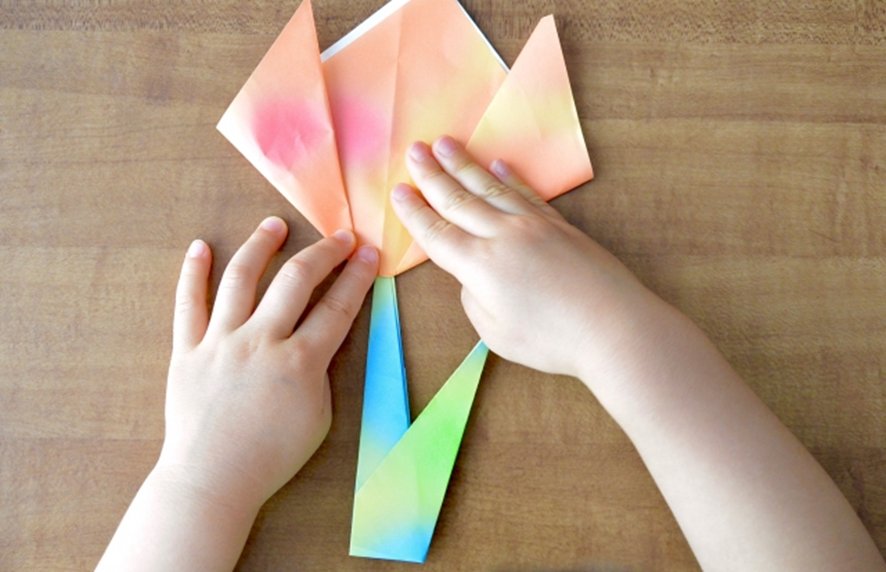 Participant preparing materials at origami workshop in Tokyo