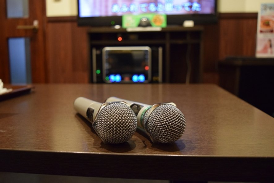 Private karaoke room interior with microphones
