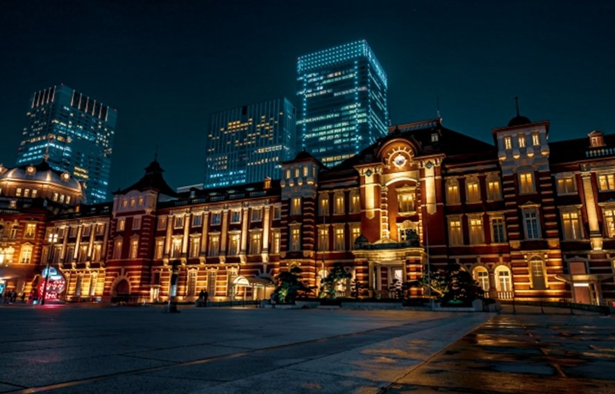 Neon-lit street scene in Tokyo at night