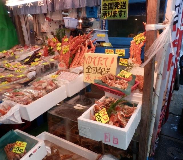 Narrow alleyway of Tsukiji market lined with specialty food shops