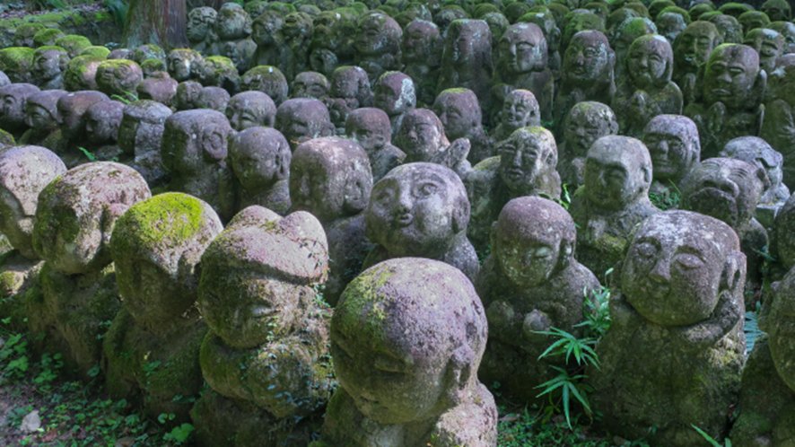 Stone rakan statues with unique expressions at Otagi Nenbutsuji