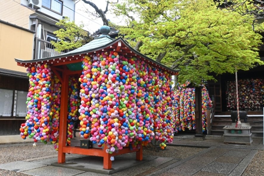 Colorful kukurizaru charms hanging at Yasaka Koshindo Temple