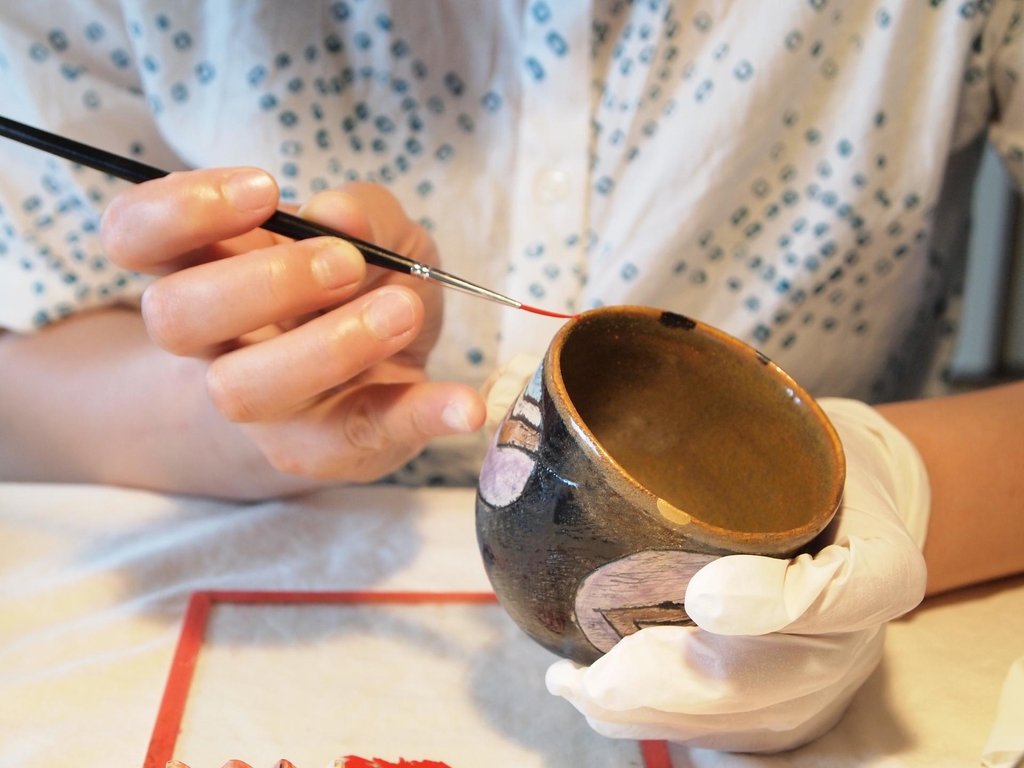 Kintsugi repaired ceramic bowl with golden seam