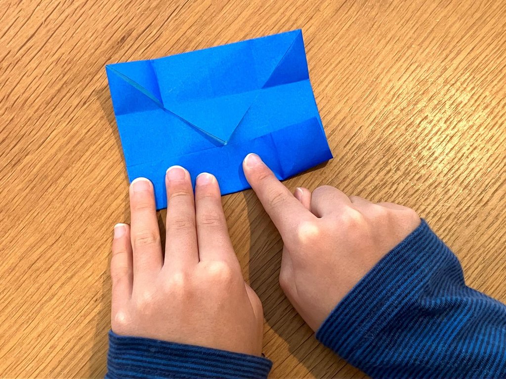 Children folding origami in Japanese classroom